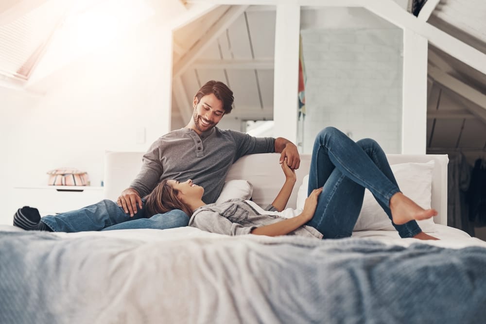 Relax,,Couple,And,Holding,Hands,In,Bed,In,The,Morning